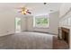 Spacious living room with a brick fireplace, a window seat, and neutral carpet at 107 Edgewater Way, Peachtree City, GA 30269