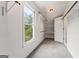 Bright walk-in closet with carpet, shelves, and natural light from a window at 107 Edgewater Way, Peachtree City, GA 30269