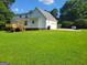 Spacious backyard featuring a deck and green lawn at 424 Ivey Edwards Ln, Mcdonough, GA 30253