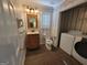 Traditional bathroom features patterned walls, vanity, toilet and washer dryer combo at 424 Ivey Edwards Ln, Mcdonough, GA 30253
