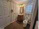 Traditional bathroom features a classic vanity, patterned walls, and tiled floor at 424 Ivey Edwards Ln, Mcdonough, GA 30253