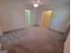 Bedroom featuring neutral walls, carpet, ceiling fan, closet and ensuite entry at 424 Ivey Edwards Ln, Mcdonough, GA 30253