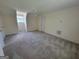 Spacious bedroom with carpeted floors, a ceiling fan, and ample natural light at 424 Ivey Edwards Ln, Mcdonough, GA 30253
