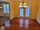 Dining room featuring hardwood floors and a decorative chandelier at 424 Ivey Edwards Ln, Mcdonough, GA 30253