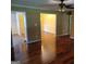 Open-concept living room with hardwood floors at 424 Ivey Edwards Ln, Mcdonough, GA 30253