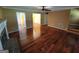 Spacious living room with hardwood floors and multiple access points to other rooms at 424 Ivey Edwards Ln, Mcdonough, GA 30253