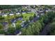 Aerial view of a neighborhood showcasing lush greenery and lake views at 184 Fashion Xing, Mcdonough, GA 30252