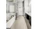 Bathroom boasts a soaking tub, a double sink vanity, and a neutral color palette at 184 Fashion Xing, Mcdonough, GA 30252