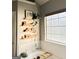 Bright bathroom features a soaking tub, stylish shelves and toiletries and a sunny window at 184 Fashion Xing, Mcdonough, GA 30252
