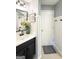 Stylish bathroom featuring a dark vanity, framed mirror, and decorative accents for a spa-like feel at 184 Fashion Xing, Mcdonough, GA 30252