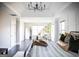 Spacious bedroom boasts a modern light fixture, a seating area, and a light, neutral color palette at 184 Fashion Xing, Mcdonough, GA 30252
