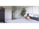 Stylish bedroom boasts a fiddle leaf fig, neutral-toned bedding, and a convenient storage unit at 184 Fashion Xing, Mcdonough, GA 30252