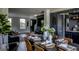 Chic dining area with a spacious table, elegant decor, and an open view to the adjacent living spaces at 184 Fashion Xing, Mcdonough, GA 30252