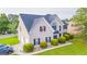 Aerial view of home featuring a manicured lawn, lush landscaping, and a classic architectural design at 184 Fashion Xing, Mcdonough, GA 30252