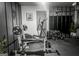 Home gym featuring exercise bike, weight bench, free weights, and rubber flooring at 184 Fashion Xing, Mcdonough, GA 30252