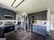 Well-equipped kitchen with stainless steel appliances, a mosaic backsplash, and dark wood flooring at 184 Fashion Xing, Mcdonough, GA 30252