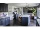 Spacious kitchen featuring an island with seating and stainless steel appliances, great for cooking and gathering at 184 Fashion Xing, Mcdonough, GA 30252