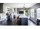 Modern kitchen with an island, pendant lighting, and dark cabinets that is perfect for culinary enthusiasts at 184 Fashion Xing, Mcdonough, GA 30252