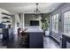 Open kitchen concept with a large island, modern lighting, and ample counter space, perfect for entertaining at 184 Fashion Xing, Mcdonough, GA 30252