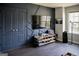Trendy living room featuring a statement wall, modern decor, and dark floors for a stylish, modern look at 184 Fashion Xing, Mcdonough, GA 30252