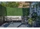 Outdoor patio with comfortable seating, privacy greenery, and stylish decor at 184 Fashion Xing, Mcdonough, GA 30252