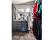 Walk-in closet features ample hanging space, a stylish geometric wallpaper, and a vanity area at 184 Fashion Xing, Mcdonough, GA 30252