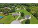 Aerial view of the property showcasing a well-maintained home, a large yard, and mature trees at 603 Rossie Court, Mcdonough, GA 30252