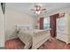 Comfortable bedroom with carpet flooring, a ceiling fan, and a window at 603 Rossie Court, Mcdonough, GA 30252