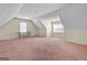 Spacious bonus room with neutral walls and carpet would make an ideal playroom, office, or living area at 603 Rossie Court, Mcdonough, GA 30252