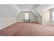 Spacious bonus room with neutral walls and carpet would make an ideal playroom, office, or living area at 603 Rossie Court, Mcdonough, GA 30252