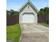 Detached garage with new siding and an extended driveway with a convenient turnaround at 603 Rossie Court, Mcdonough, GA 30252