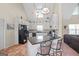 Bright kitchen with vaulted ceilings, granite counters, breakfast bar and seating at 603 Rossie Court, Mcdonough, GA 30252