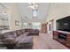 Spacious living room featuring vaulted ceiling, fan, and comfortable seating at 603 Rossie Court, Mcdonough, GA 30252