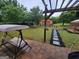 The backyard boasts a large, fenced yard with seating, perfect for outdoor relaxation at 45 Oak Wood Lane, Covington, GA 30016