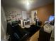 A bedroom featuring a grey futon, white desk, and black rug at 45 Oak Wood Lane, Covington, GA 30016