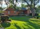 Single-Gathering home with a well-manicured lawn and established landscaping, creating a welcoming exterior at 45 Oak Wood Lane, Covington, GA 30016