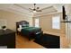 A spacious main bedroom showcases a tray ceiling, fan, and ample natural light at 45 Oak Wood Lane, Covington, GA 30016