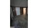Basement area with paneled walls and a view to another room at 5277 Scofield Rd, South Fulton, GA 30349