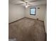 Empty bedroom with a ceiling fan and window offering plenty of light at 5277 Scofield Rd, South Fulton, GA 30349