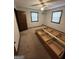 Bedroom with two windows, ceiling fan, and storage bed components at 5277 Scofield Rd, South Fulton, GA 30349