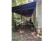 Exterior view featuring a covered and fenced-in area attached to the building side at 5277 Scofield Rd, South Fulton, GA 30349