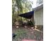 A view of the exterior with a covered fenced in area attached to the side at 5277 Scofield Rd, South Fulton, GA 30349