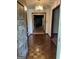 Inviting foyer with hardwood floors, chandelier lighting, and open access to other rooms at 5277 Scofield Rd, South Fulton, GA 30349