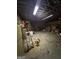 Spacious garage interior with overhead lighting, concrete floor, and ladder in view at 5277 Scofield Rd, South Fulton, GA 30349