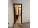 View of hallway and connecting bathroom, with patterned flooring at 5277 Scofield Rd, South Fulton, GA 30349