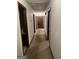 Hallway with carpet and multiple doors for easy access to rooms at 5277 Scofield Rd, South Fulton, GA 30349