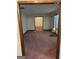 Carpeted living room with white walls, and view into dining room with natural lighting at 5277 Scofield Rd, South Fulton, GA 30349