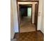 Foyer view into living room with carpet floors and fireplace at 5277 Scofield Rd, South Fulton, GA 30349