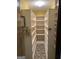Walk-in pantry featuring custom built shelving and unique vintage flooring at 5277 Scofield Rd, South Fulton, GA 30349