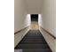 Staircase with carpeted steps leading to the lower level at 5277 Scofield Rd, South Fulton, GA 30349